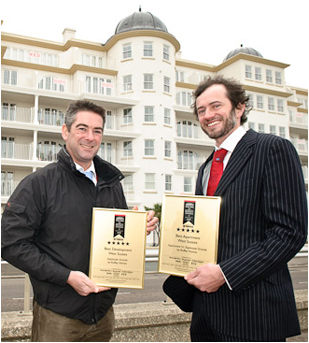 Ben Cheal of Roffey Homes and Ian Smalley of Neil Holland Architects with the Awards outside the Esplanade Grande